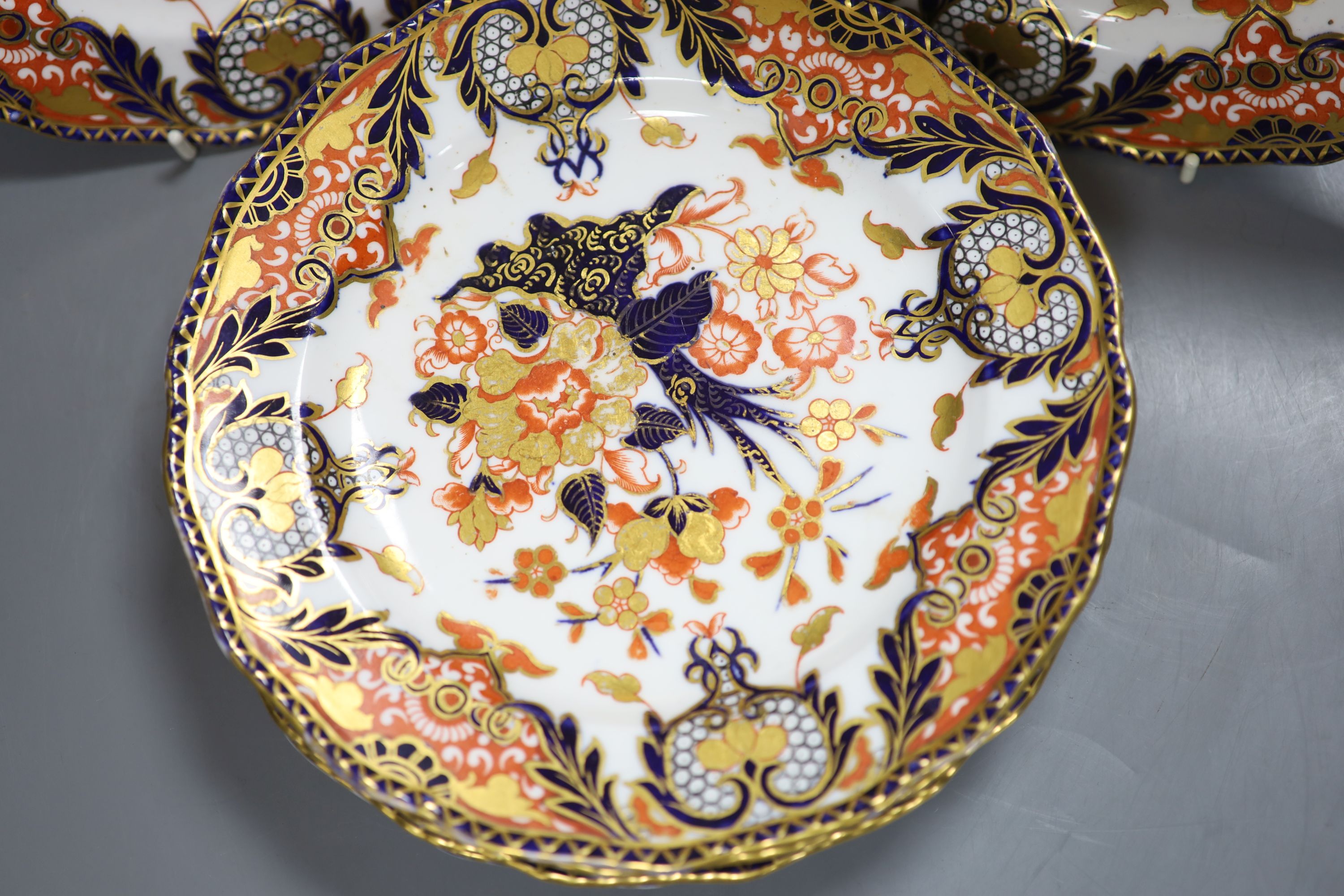 A set of six Royal Crown Derby dessert dishes, decorated in an Imari palette, diameter 23cm